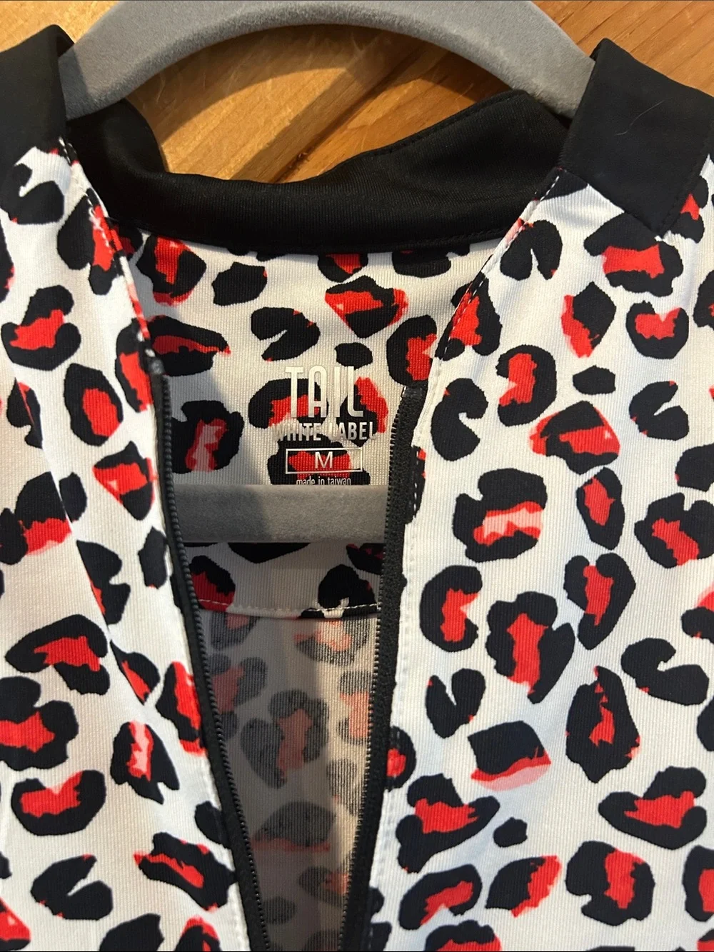 Tail White Label red & black leopard sleeveless golf top